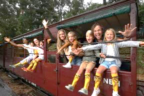A group of people on a train Description automatically generated