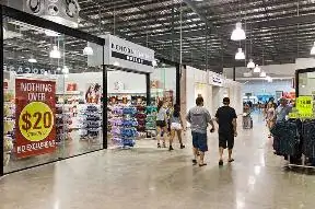 People walking in a mall Description automatically generated
