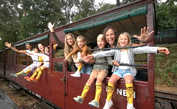 A group of people on a train Description automatically generated
